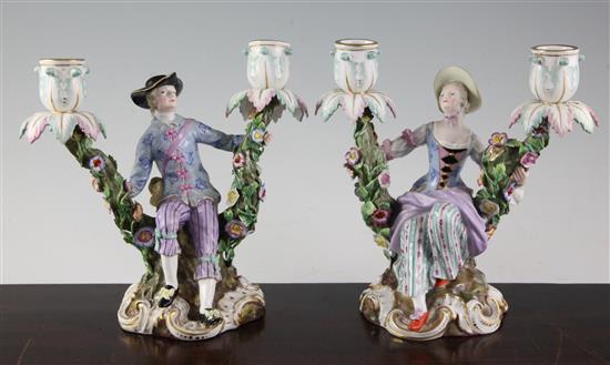 A pair of Meissen figural candelabra, later 19th century, height 19.5cm, typical minor losses to flowers